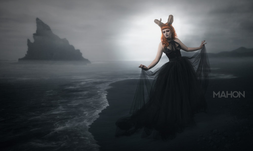 The Siren with horns, and a gothic ballgown, dances at the edge of a CGI lake.